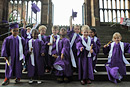 Children in costume play on the steps