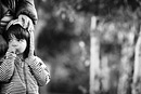 A mother and son take a rest in the park, black and white image