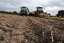 Tractors tending the land on a farm