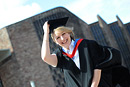 A happy graduate outside Coventry Cathedral