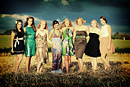 Female models in a sunflower field during a fashion shoot