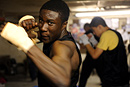 A boxer shadow boxing during training