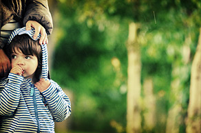 An example of our children's photography, a boy with his mother in a natural pose