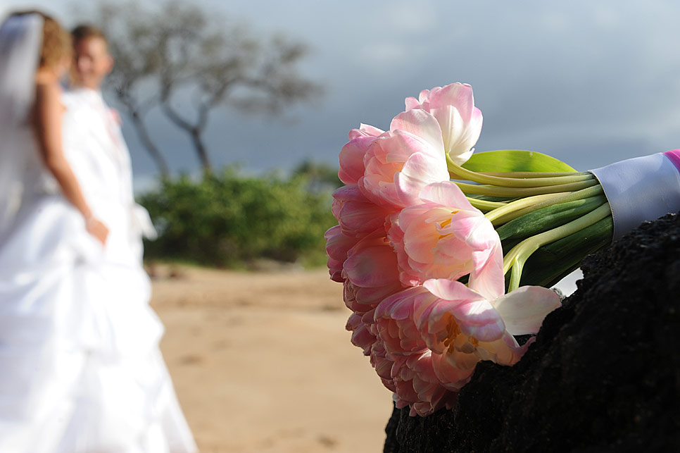 The couple and the wedding flowers