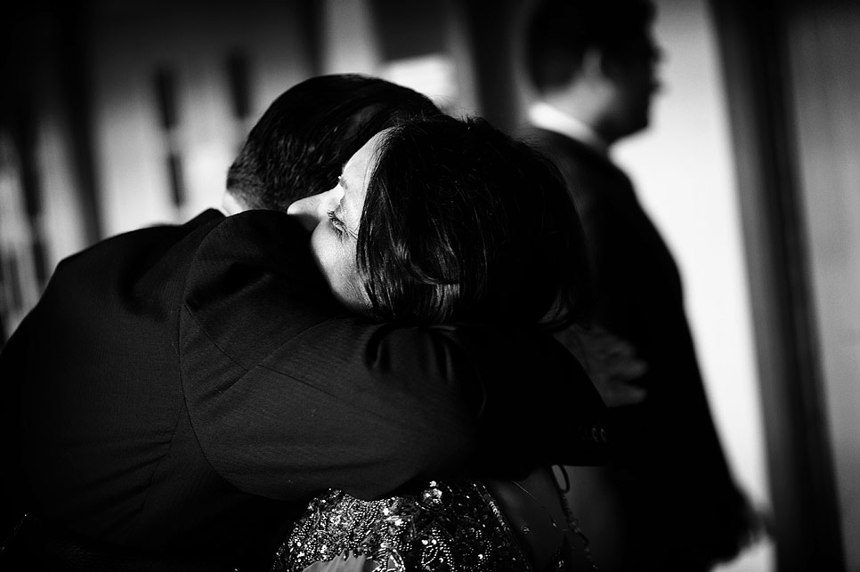 Brides mother hugging a guest