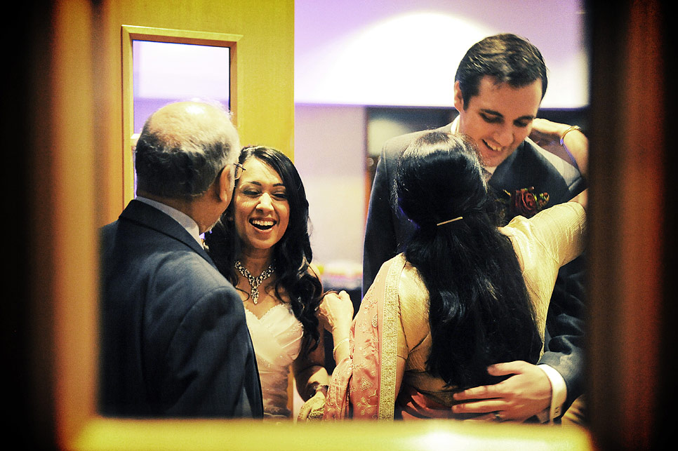 Bride and groom welcoming guests