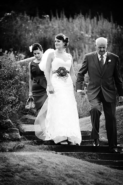 The bride looks over at the wedding guests