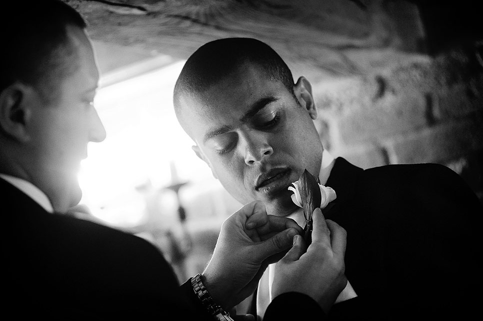 The groom helping an usher