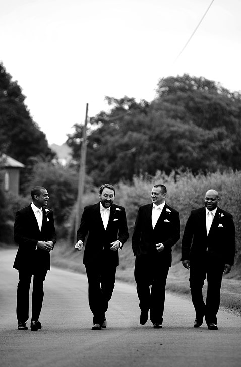 The groom and ushers talking speeches