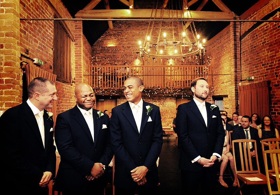 Relaxed ushers with the nervous groom