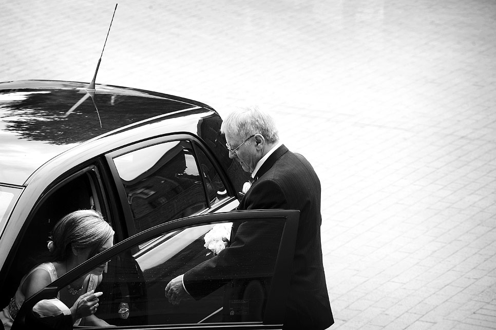 The father of the bride assists his daughter